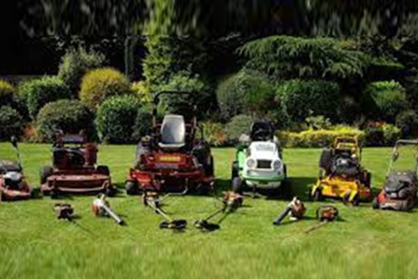 Various gardening equipment and ride-on lawn mowers